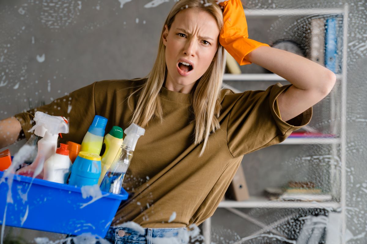 woman-holding-cleaning-supplies-with-frustrated-ex-2026-09-23-16-57-08-cover
